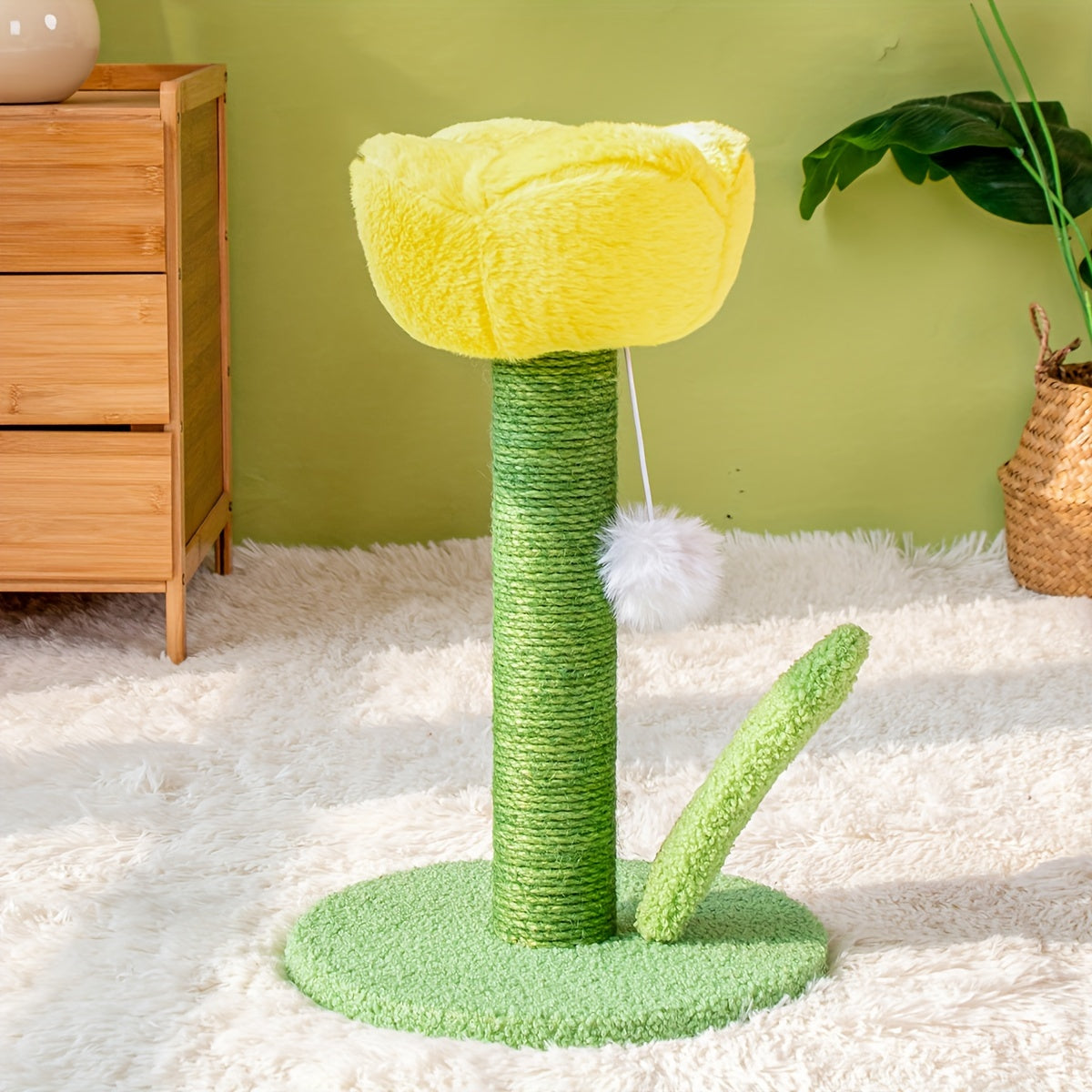 Cat tree shaped like a flower with a yellow top and green base on a white carpet.