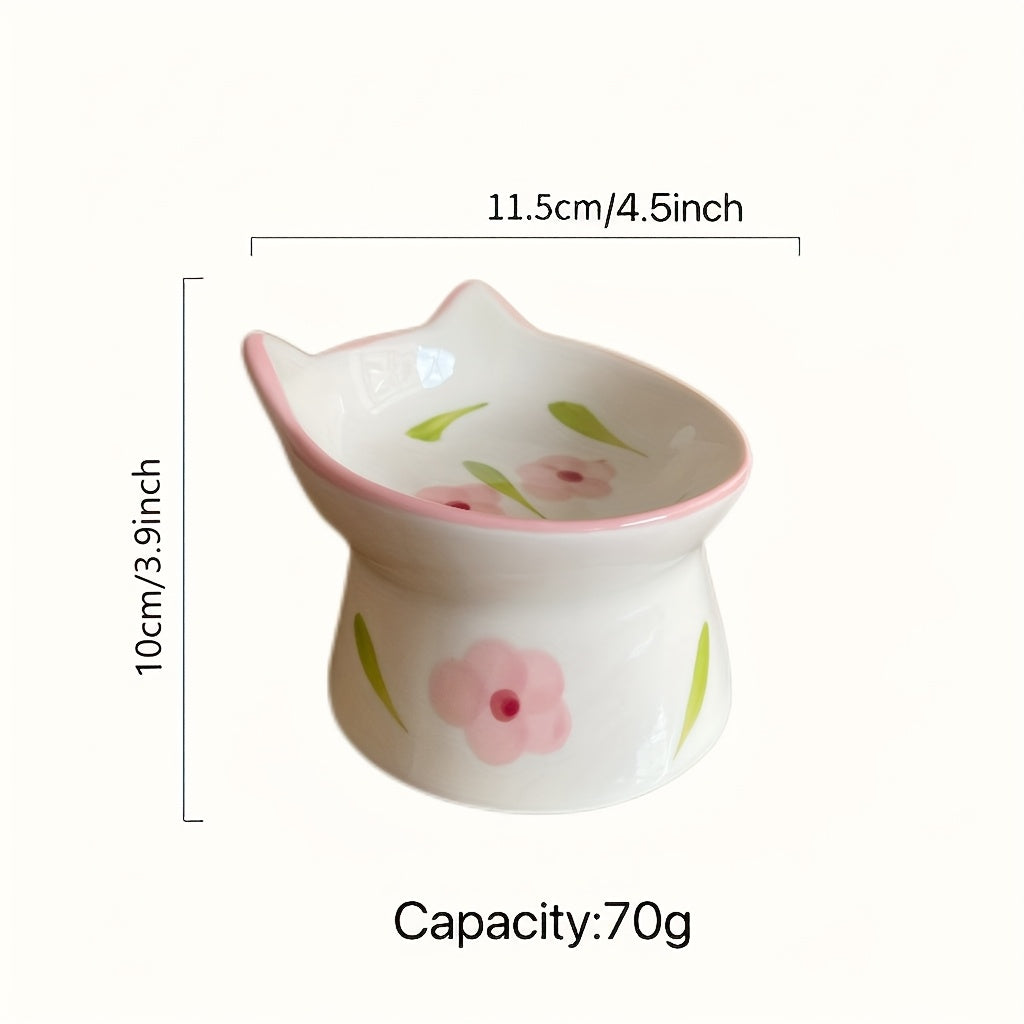 Ceramic cat-shaped container with floral design and measurements on a white background