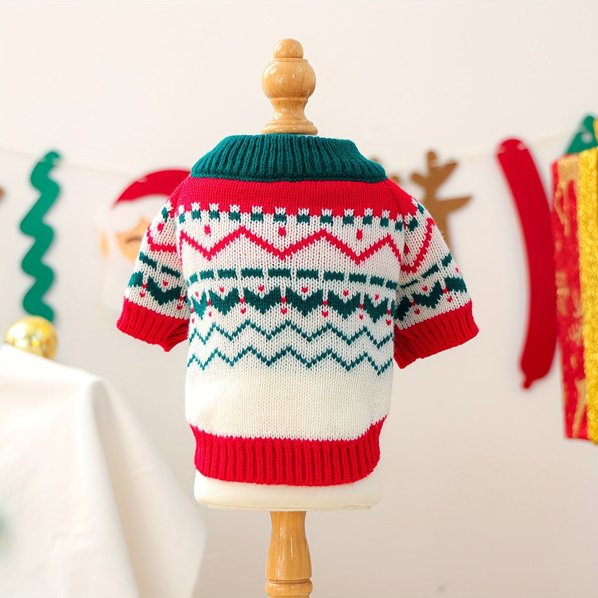 Colorful knitted sweater on a mannequin with a festive background