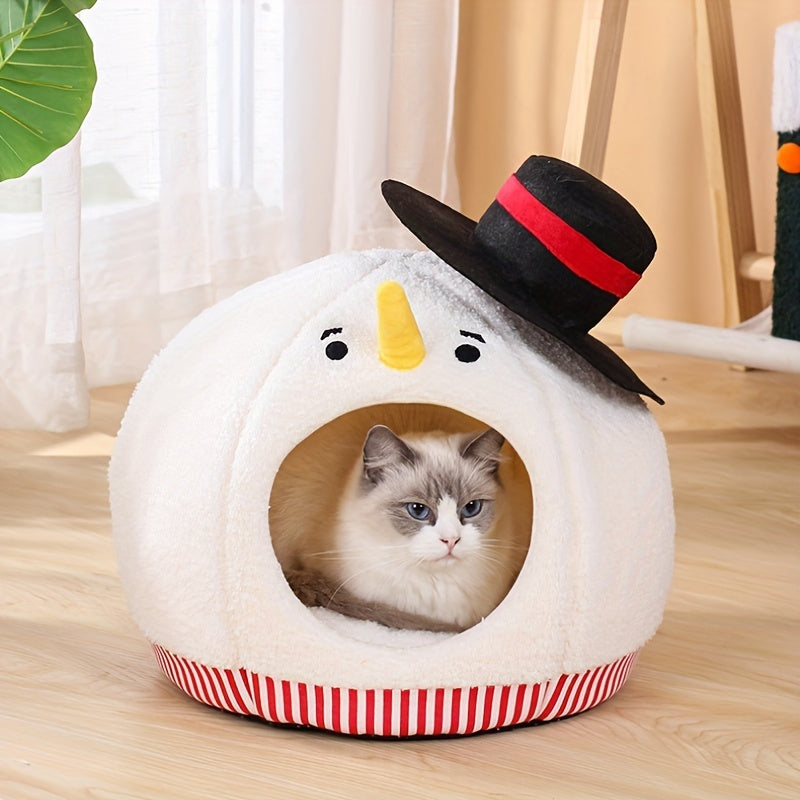 Cat peeking out from a snowman-shaped pet bed with a top hat on a wooden floor.