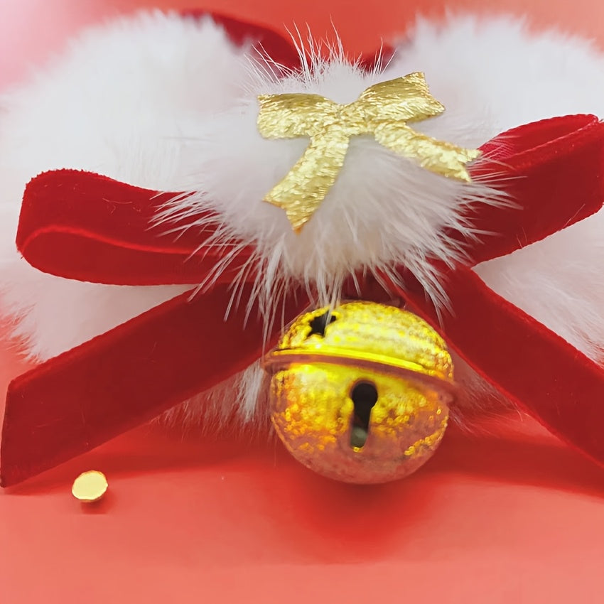 Decorative bell with red ribbon and gold bow on a red background