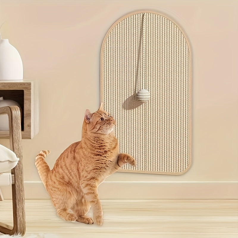 Cat playing with a wall-mounted cat toy on a beige wall.