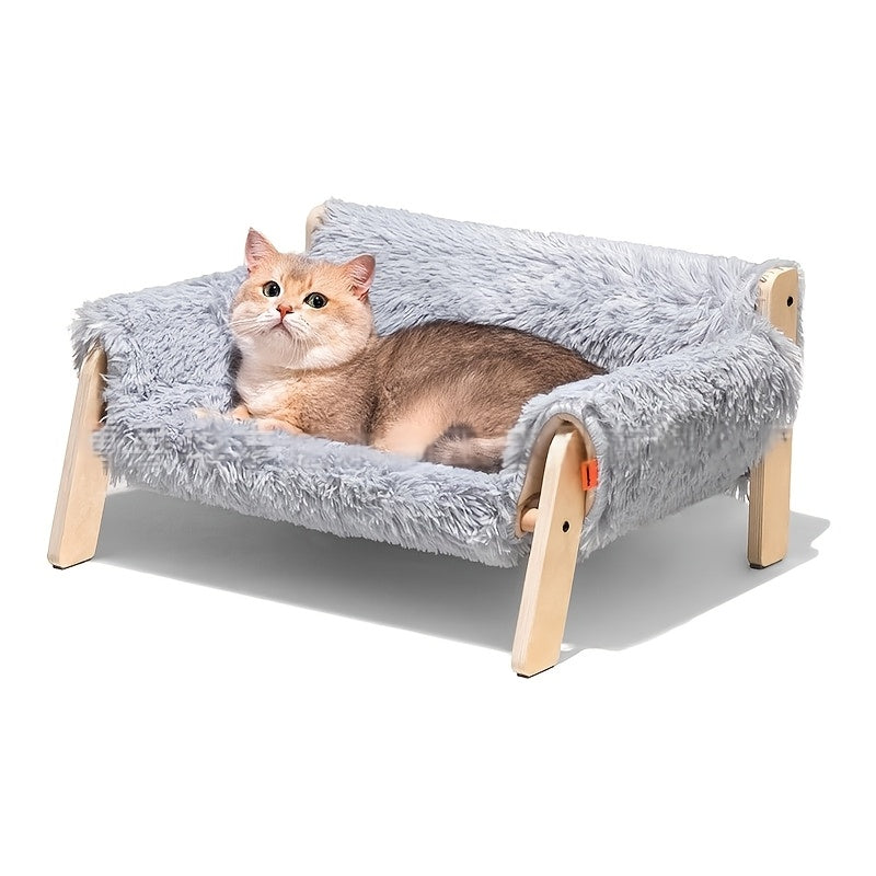 Cat lying on a fluffy pet bed with wooden frame on a white background