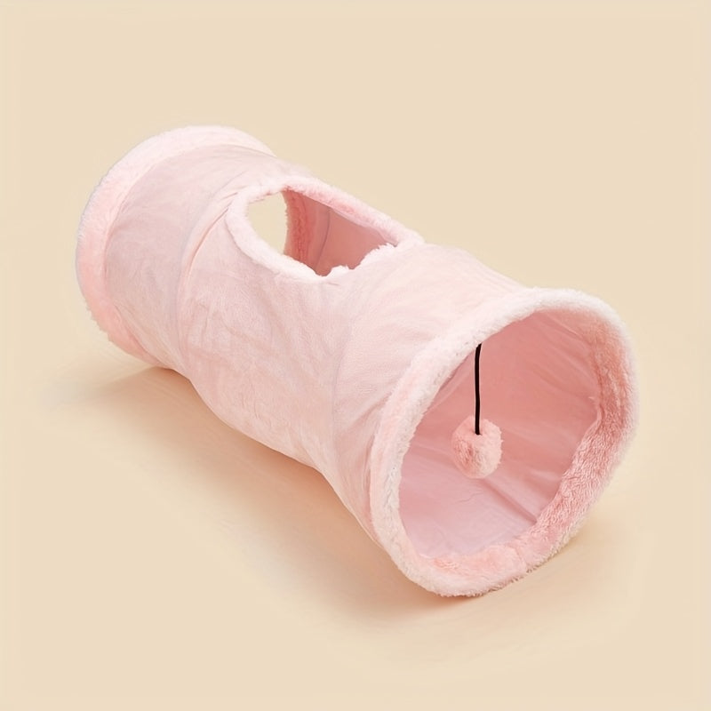 Pink plush tunnel toy on a beige background