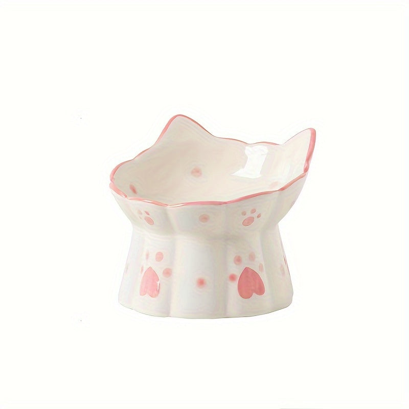 Cat-shaped ceramic bowl with pink accents on a white background