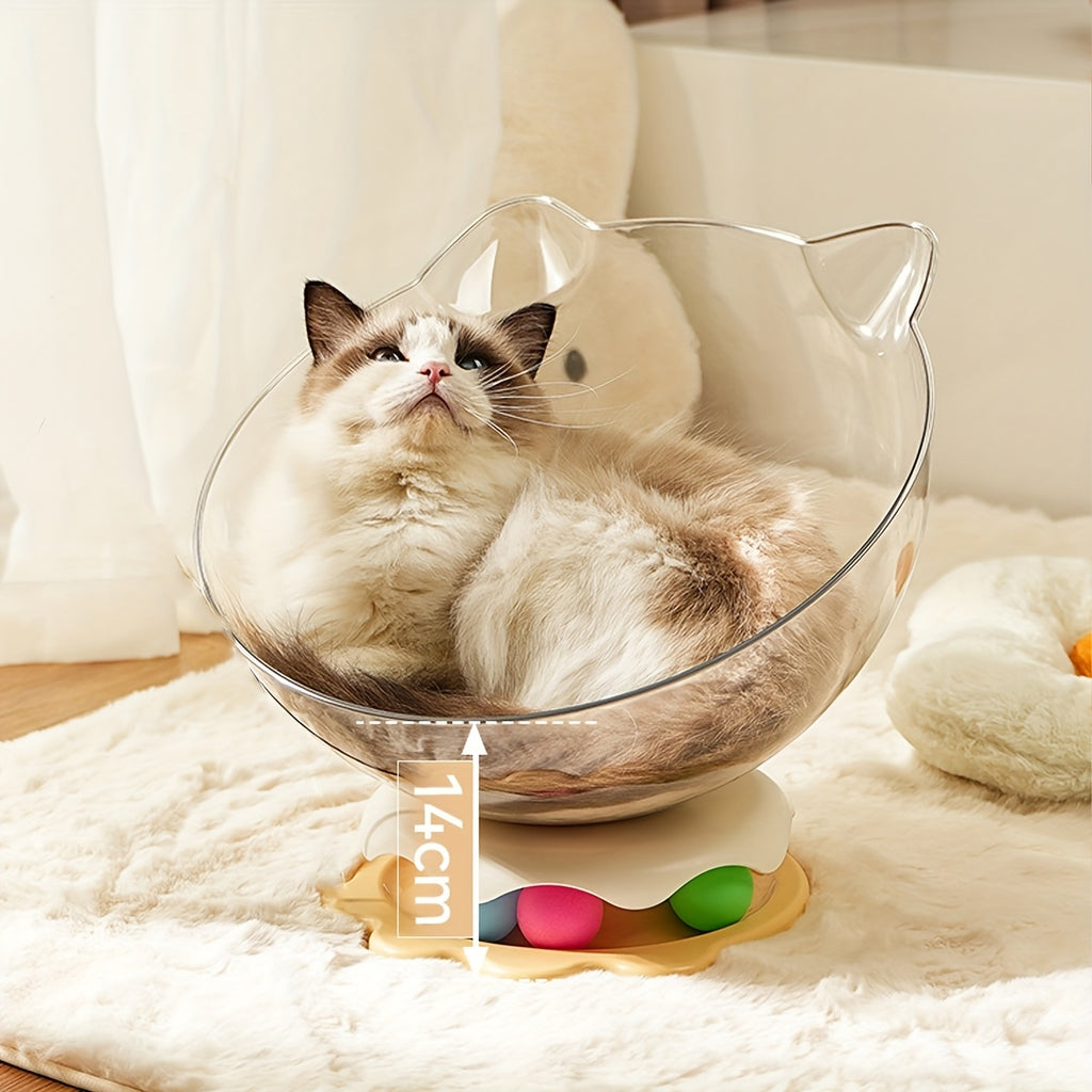 Cat sitting inside a transparent cat-shaped chair on a soft surface.