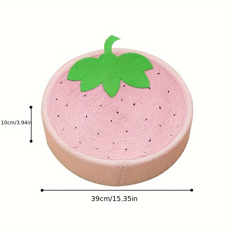 Pink strawberry-shaped cushion with green leaf on a white background