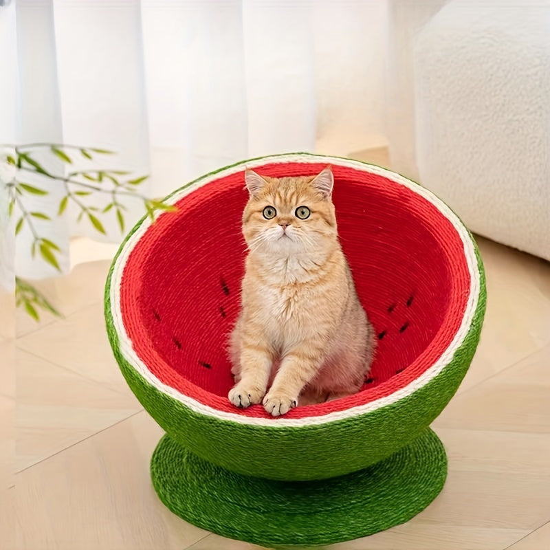 Cat sitting inside a watermelon-shaped pet bed on a light wooden floor.