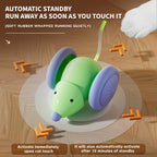 Toy mouse with purple wheels on a wooden surface, featuring text about automatic standby and touch activation.
