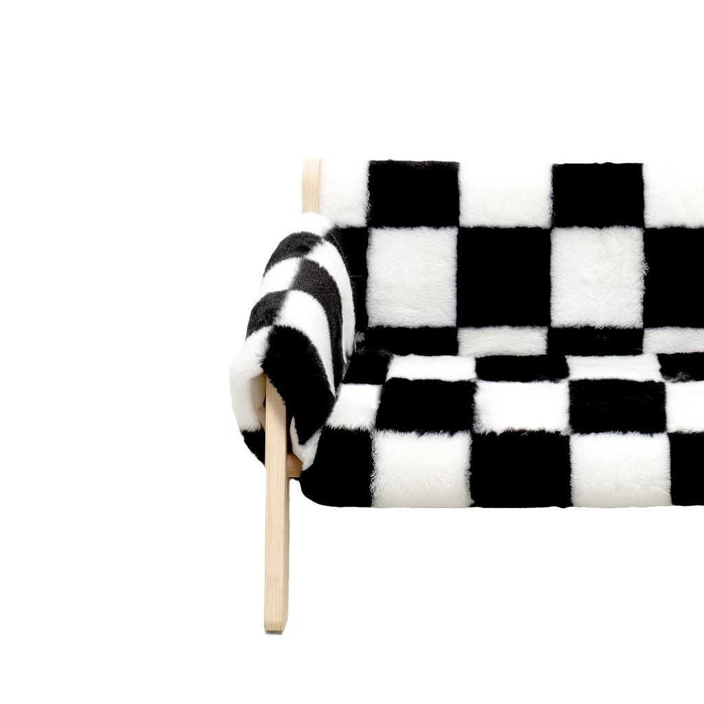 Black and white checkered blanket on a white background