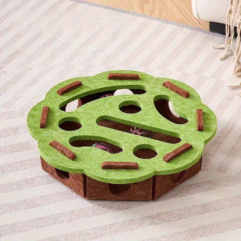 Green and brown puzzle toy on a striped surface